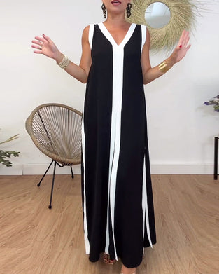 Fasjonabel ermeløs kjole med V-hals i kontrasttrykk