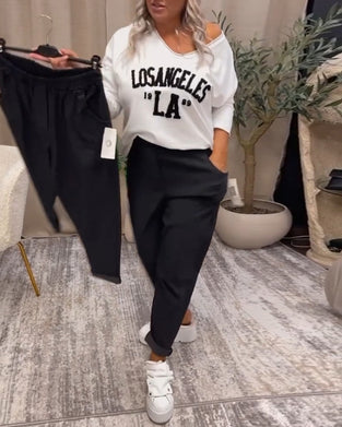 Uformell genser med v-hals med bokstavtrykk