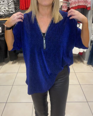 Løs topp med lange ermer og glidelås