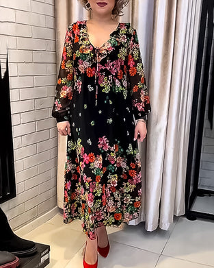 Elegant kjole med V-hals med blomstertrykk