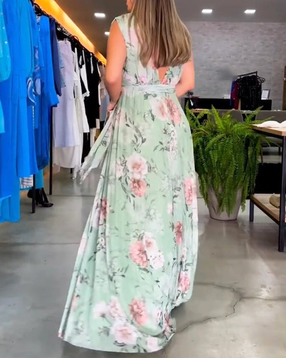 Elegant ermeløs kjole med V-hals med blomstertrykk