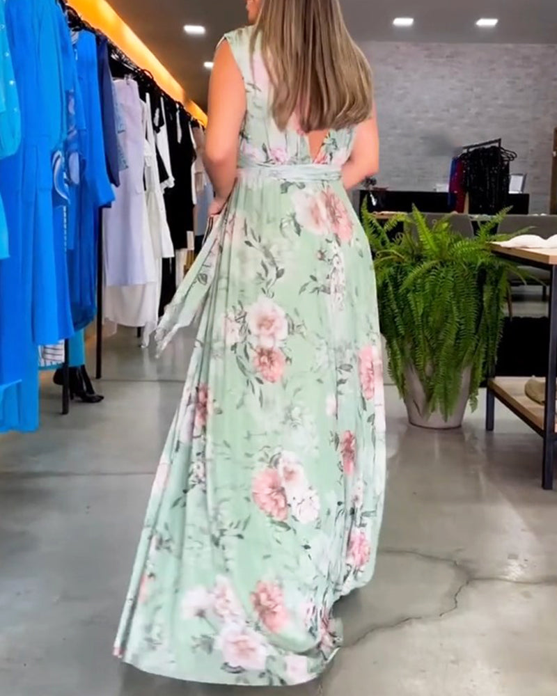 Elegant ermeløs kjole med V-hals med blomstertrykk