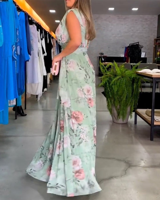 Elegant ermeløs kjole med V-hals med blomstertrykk