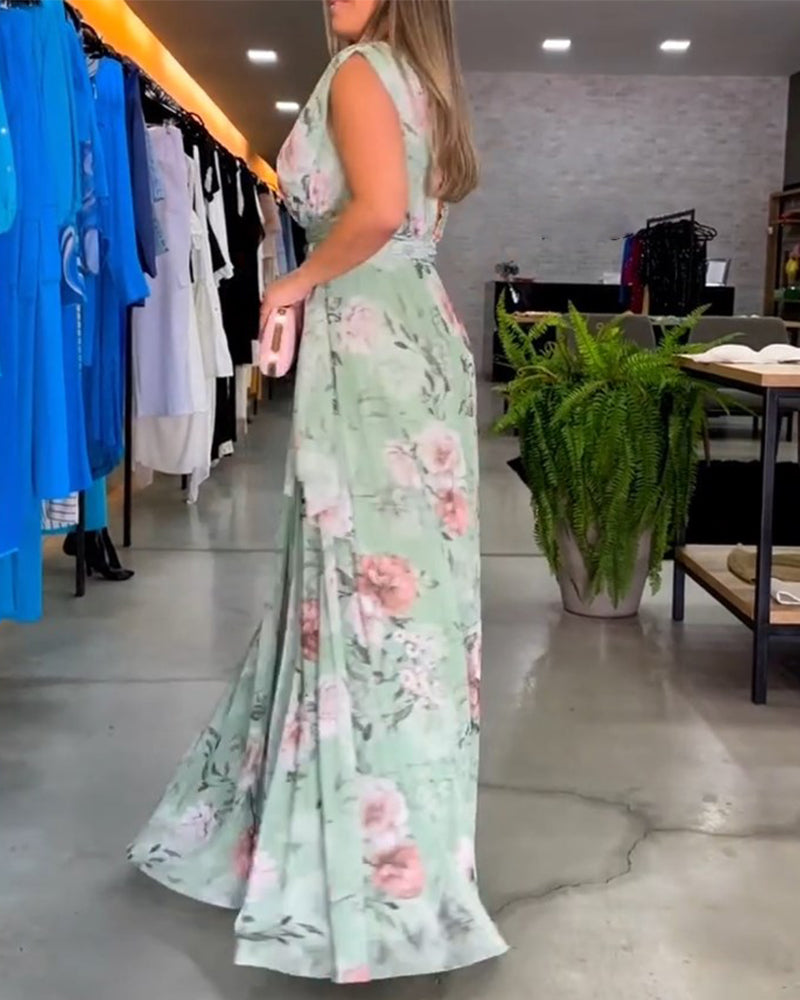 Elegant ermeløs kjole med V-hals med blomstertrykk