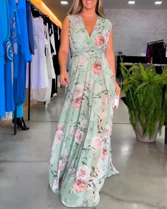 Elegant ermeløs kjole med V-hals med blomstertrykk