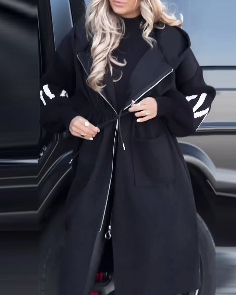 Løs lang kåpe med uformelle lommer