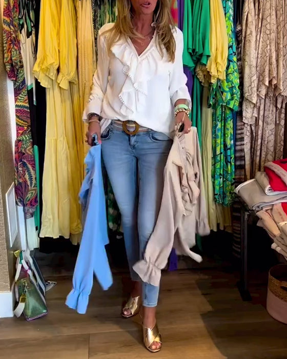 Designerbluser med volang for kvinner