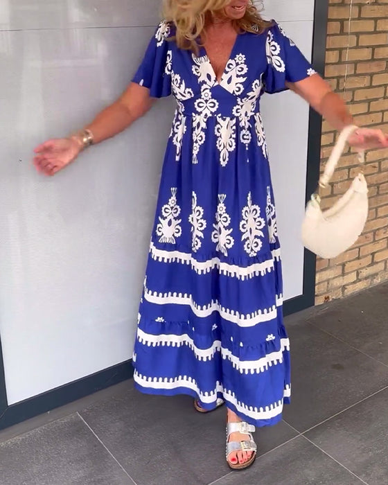 Elegant lang kjole med v-hals med vintage trykk