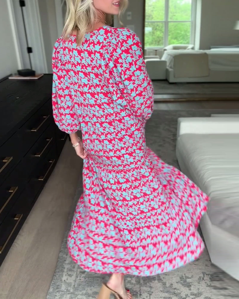 Blomstret lang kjole med V-hals med lanterneermer