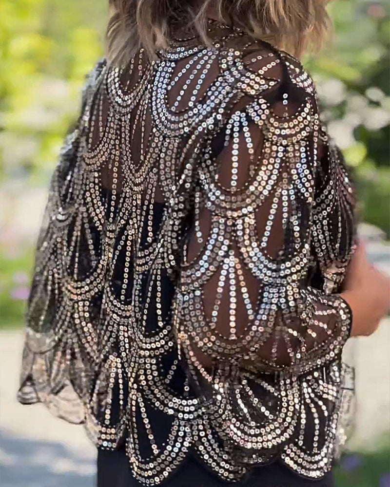 Elegant kåpe med paljetter og bølgekant