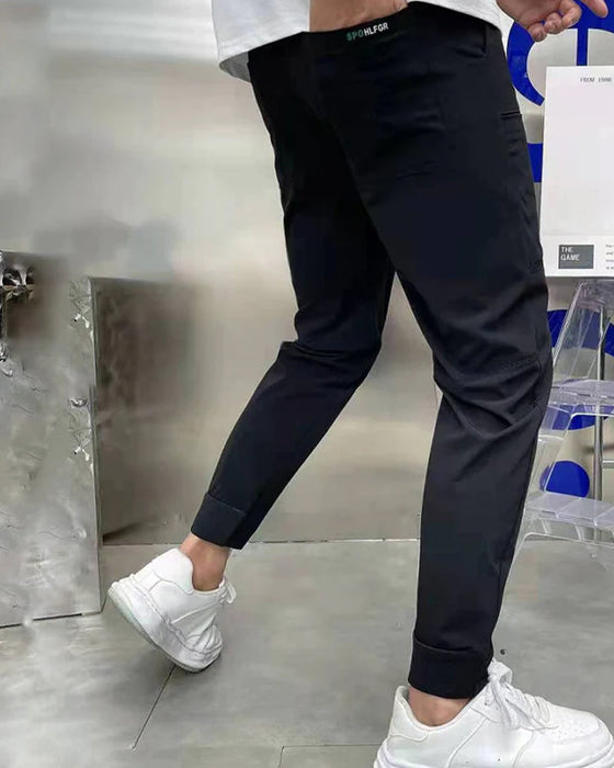 Høystrekkbare skinny cargobukser med flere lommer for menn