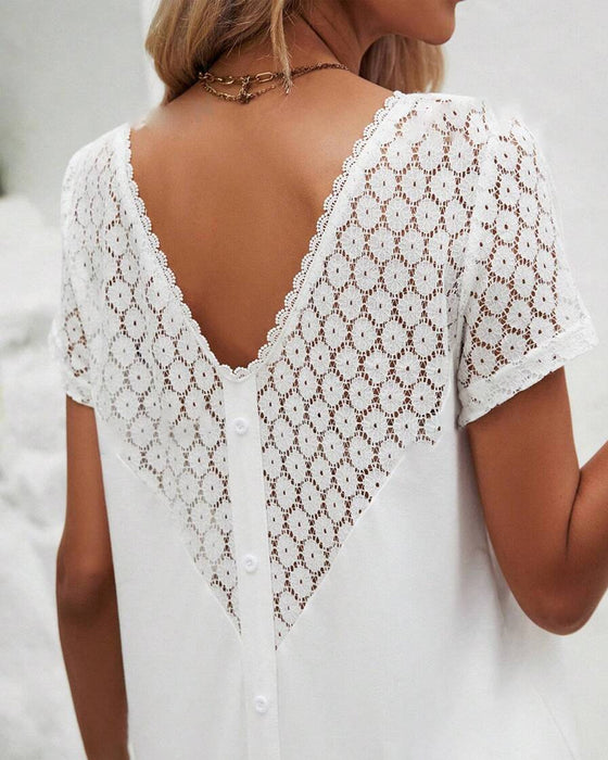 Kjole med rund hals og lappeteppe på ryggen