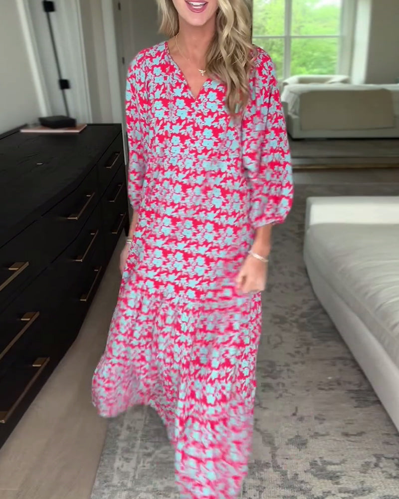 Blomstret lang kjole med V-hals med lanterneermer