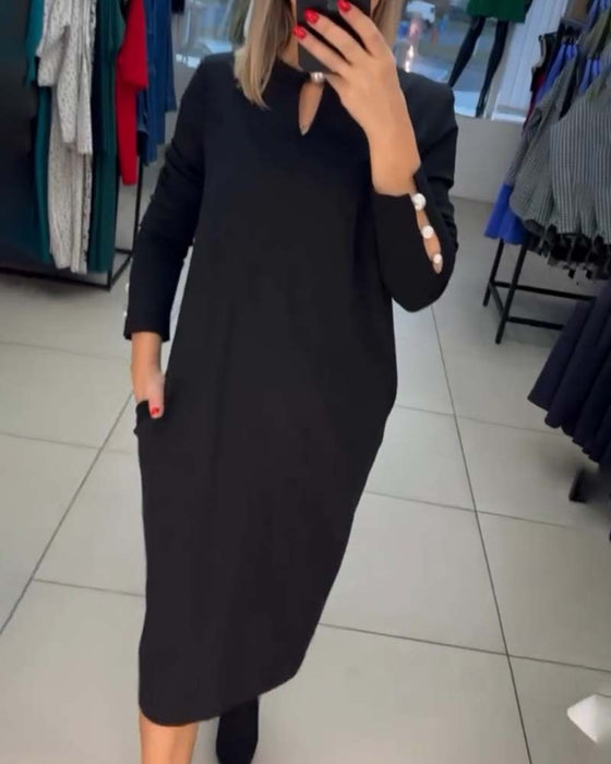 Elegant kjole med perleknapper