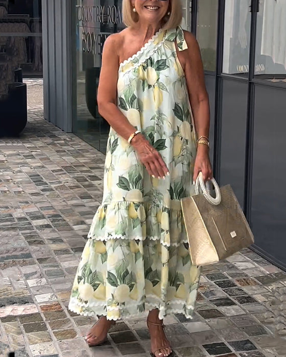 Kjole med blomstertrykk på én skulder