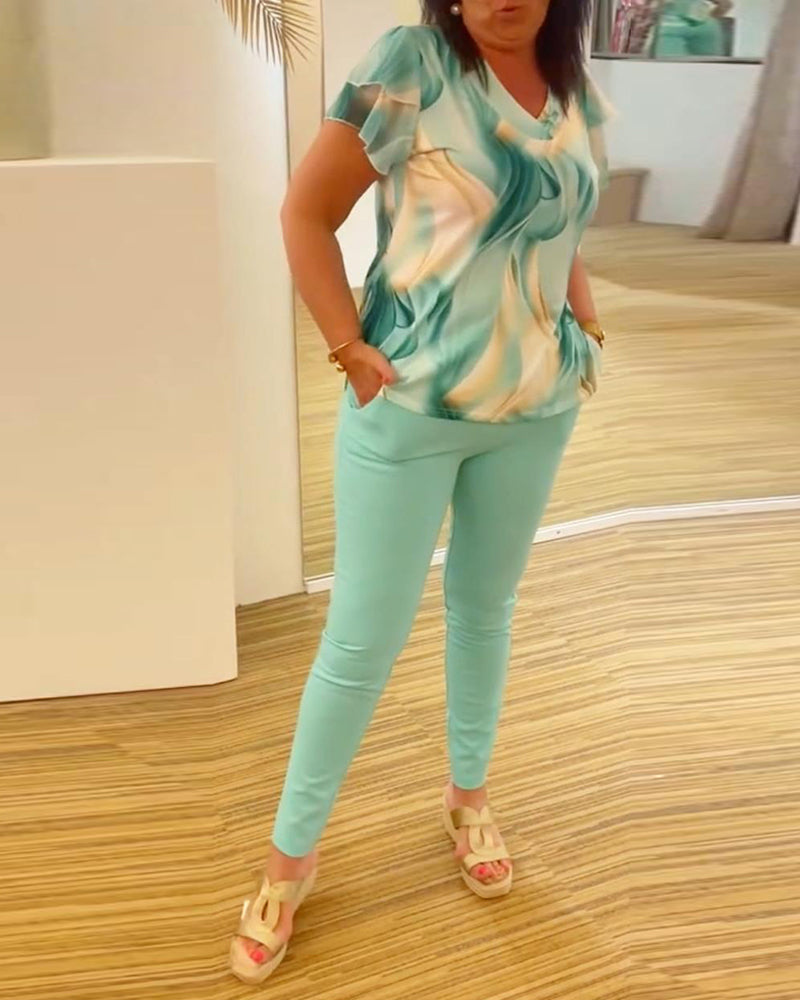 Bluse med V-hals med mønster på ermer med patchwork