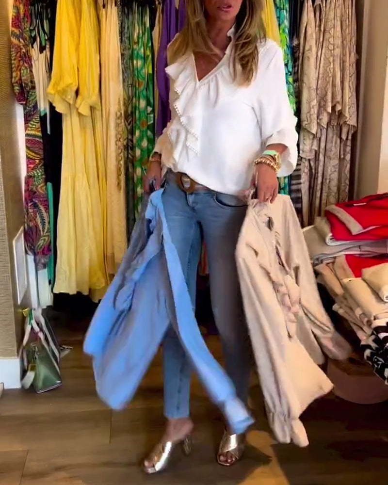 Designerbluser med volang for kvinner