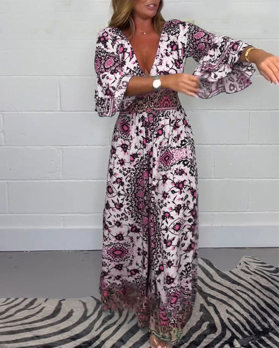 Jumpsuit med trykk og dyp V-hals