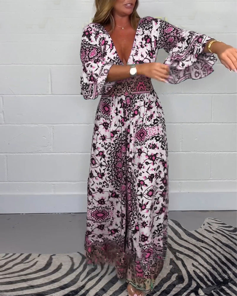 Jumpsuit med trykk og dyp V-hals