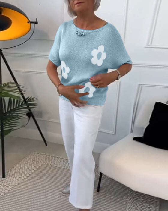 Slank blomstergenser med rund hals