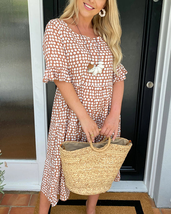 Midikjole med rund hals med prikkete trykk