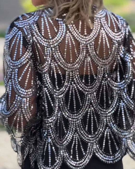 Elegant kåpe med paljetter og bølgekant