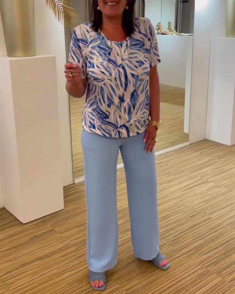 Trykt kortermet plisseret bluse med rund hals