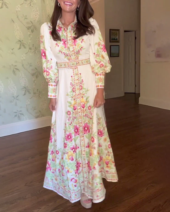 Elegant maxikjole med lange ermer i jakkeslag med blomstertrykk
