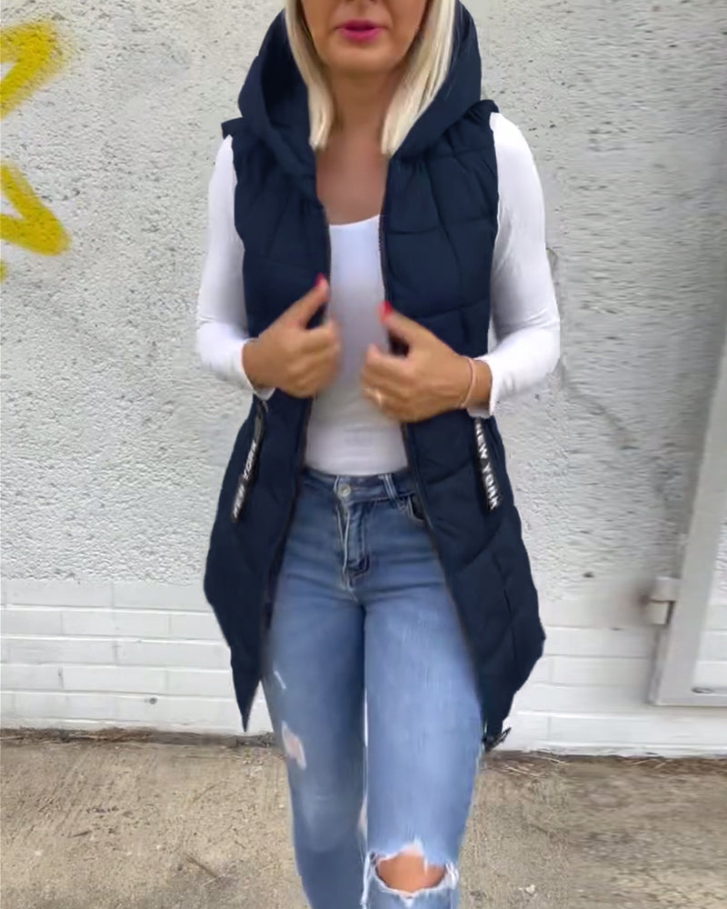 Ermeløs polstret jakke med hette med glidelås