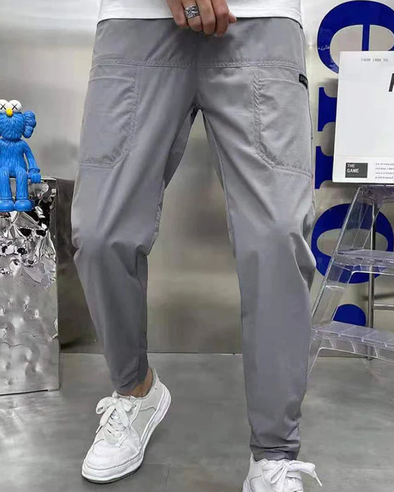 Høystrekkbare skinny cargobukser med flere lommer for menn