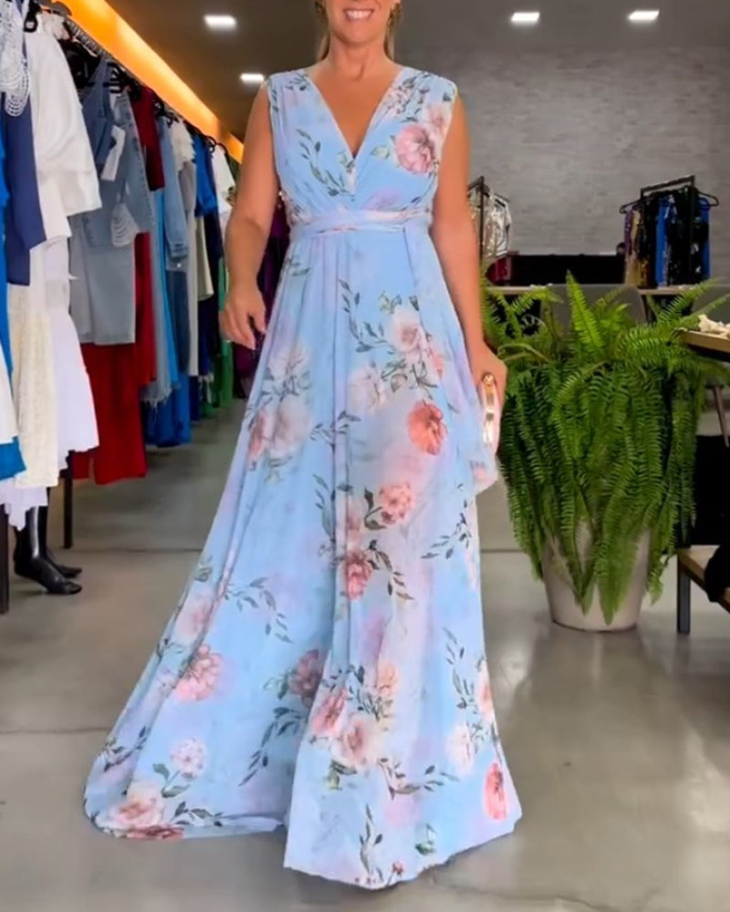 Elegant ermeløs kjole med V-hals med blomstertrykk