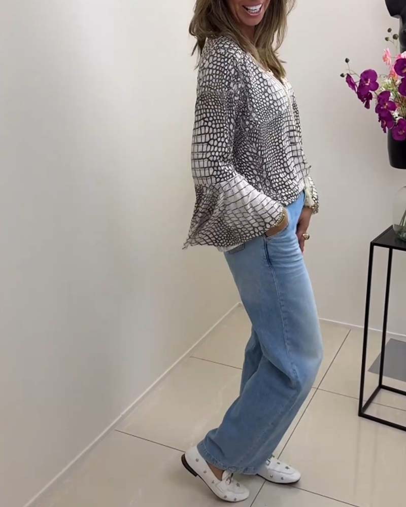 Bluse med blomstermønster og snor