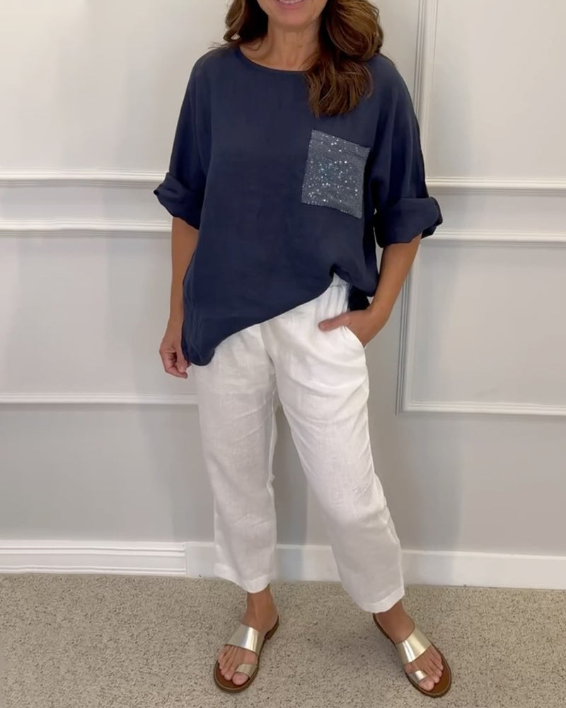 Paneldelt paljettlomme topp med rund hals