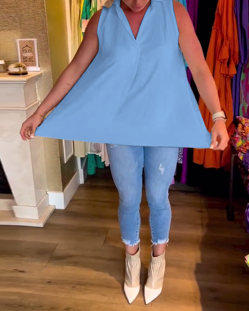 Ermeløs topp med volanger og jakkeslag