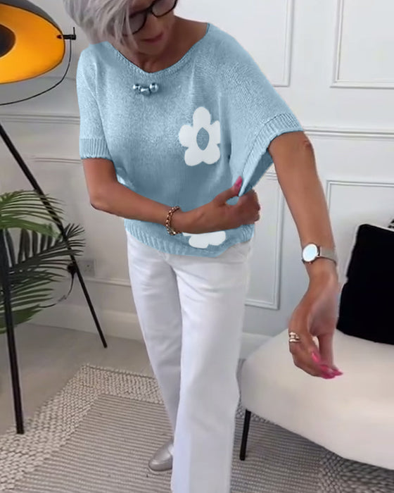 Slank blomstergenser med rund hals