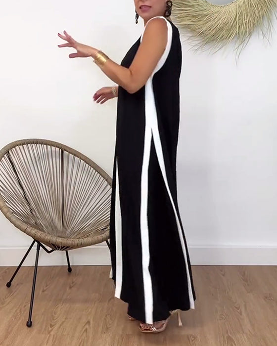 Fasjonabel ermeløs kjole med V-hals i kontrasttrykk