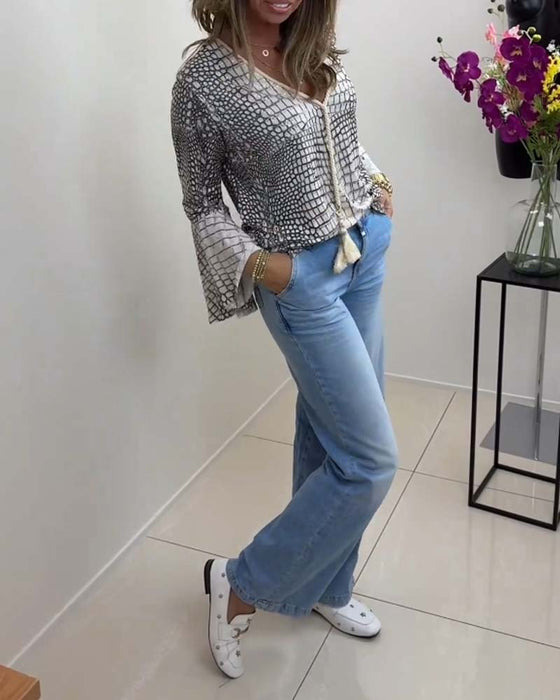 Bluse med blomstermønster og snor