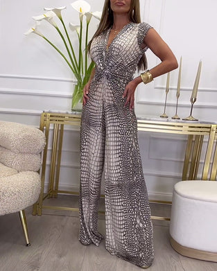 Ermeløs jumpsuit med dyp V-twist