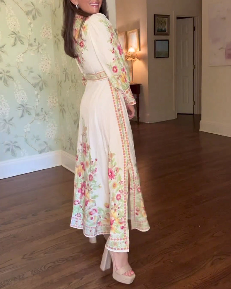 Elegant maxikjole med lange ermer i jakkeslag med blomstertrykk