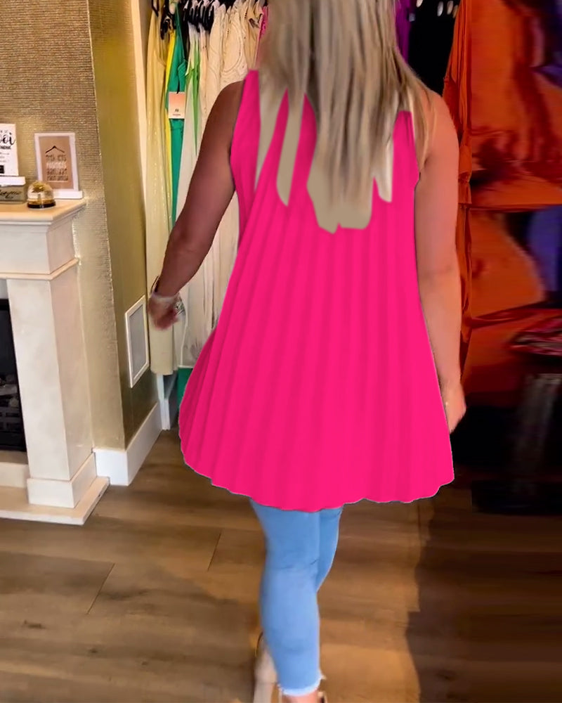 Ermeløs topp med volanger og jakkeslag