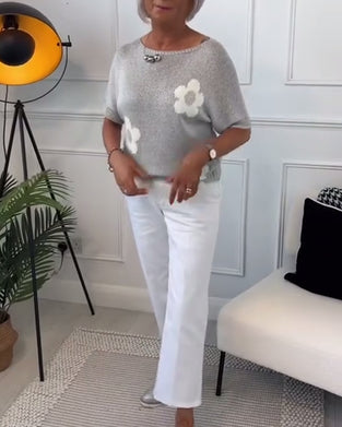 Slank blomstergenser med rund hals