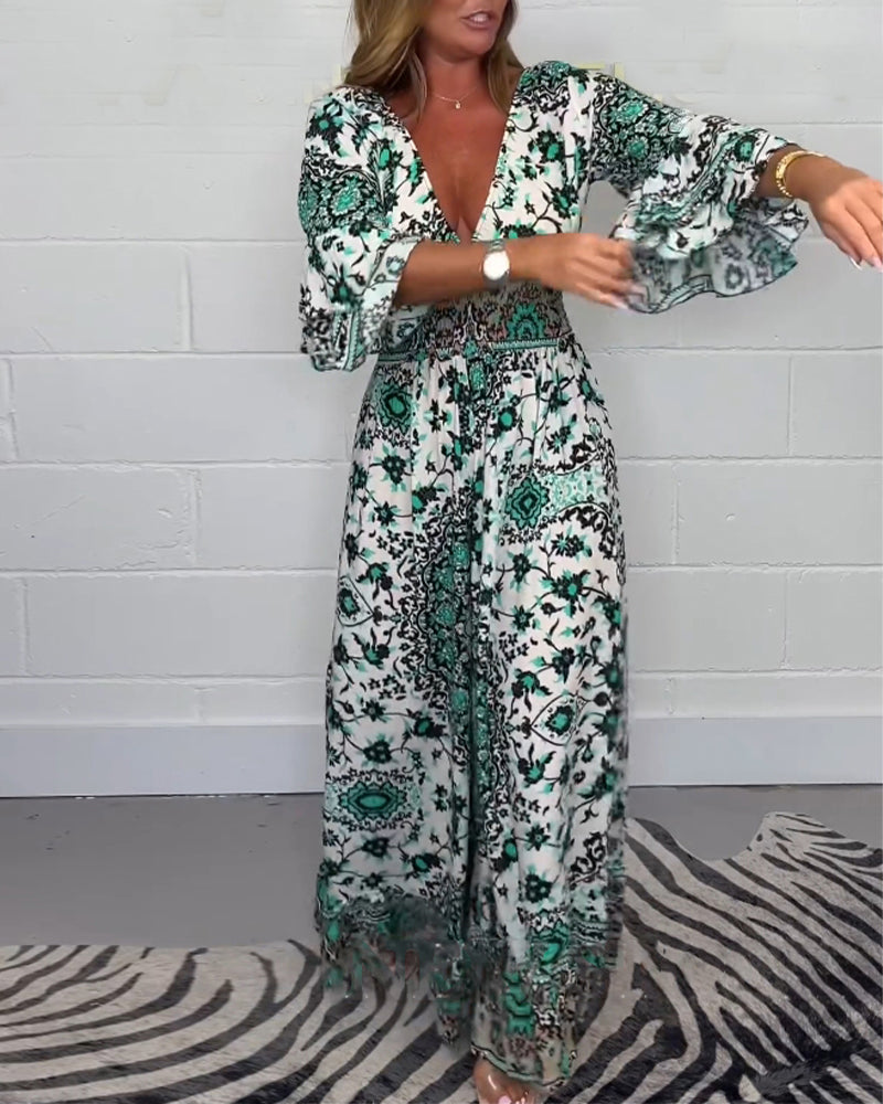 Jumpsuit med trykk og dyp V-hals