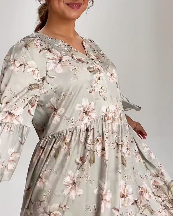 Klokkeermet kjole med blomstertrykk