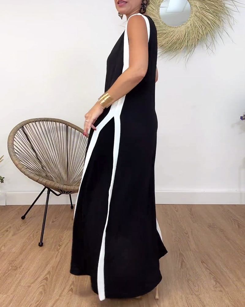 Fasjonabel ermeløs kjole med V-hals i kontrasttrykk