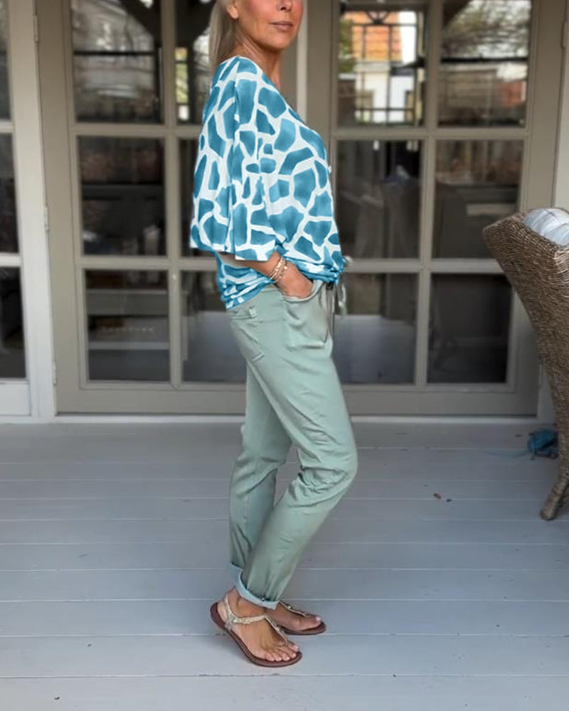 Elegant bluse med V-hals med flaggermusermer