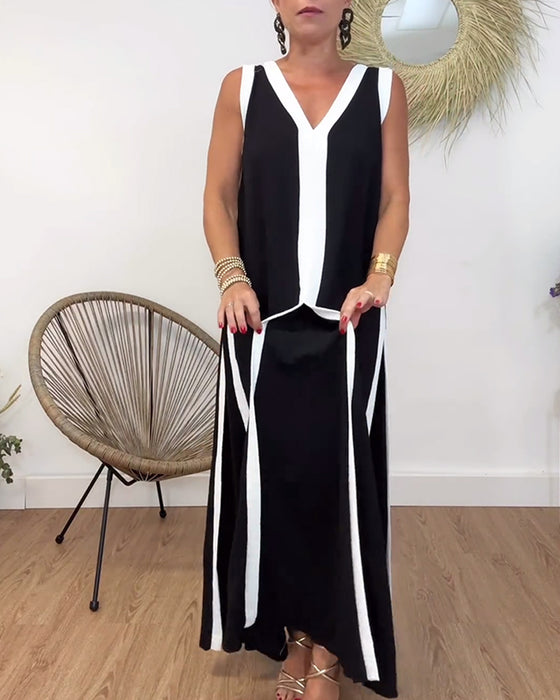 Fasjonabel ermeløs kjole med V-hals i kontrasttrykk