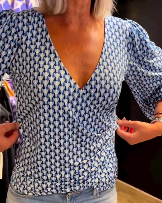 Lang ermet topp med dyp V-hals