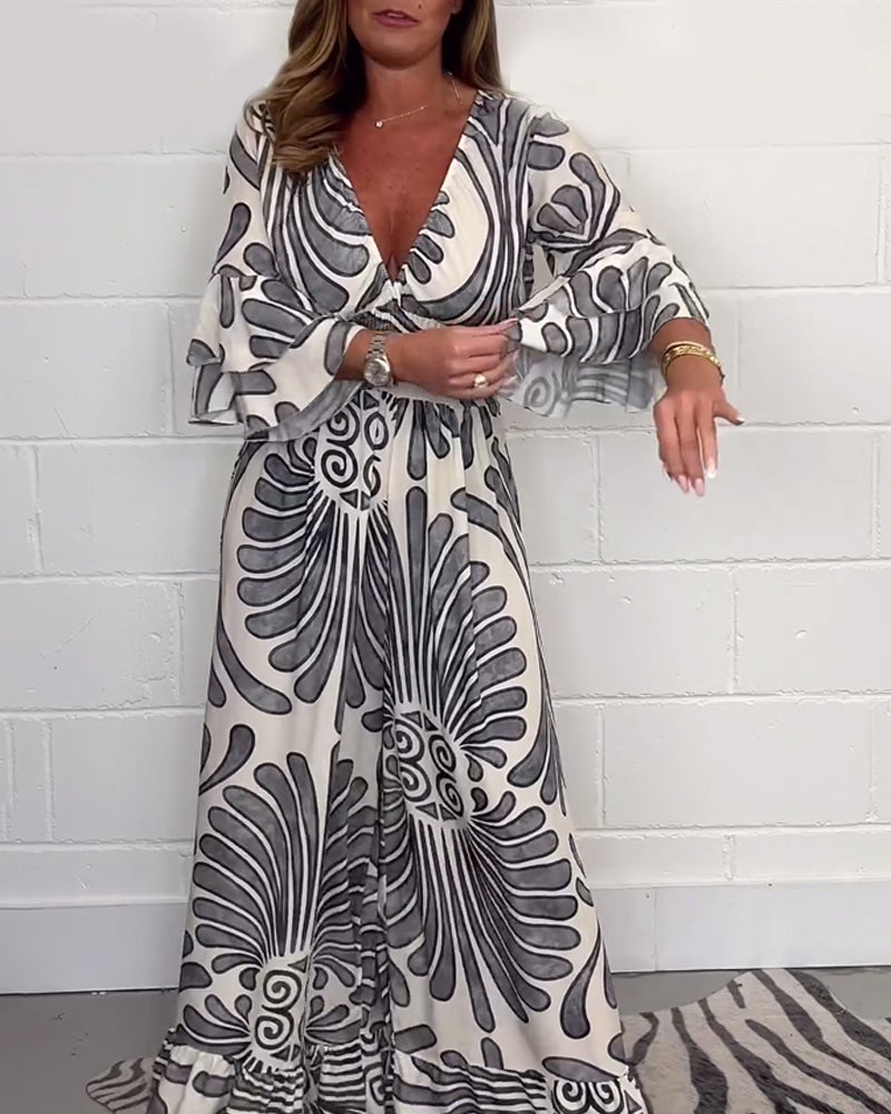 Deep V løs jumpsuit med retroprint og klokkeerm
