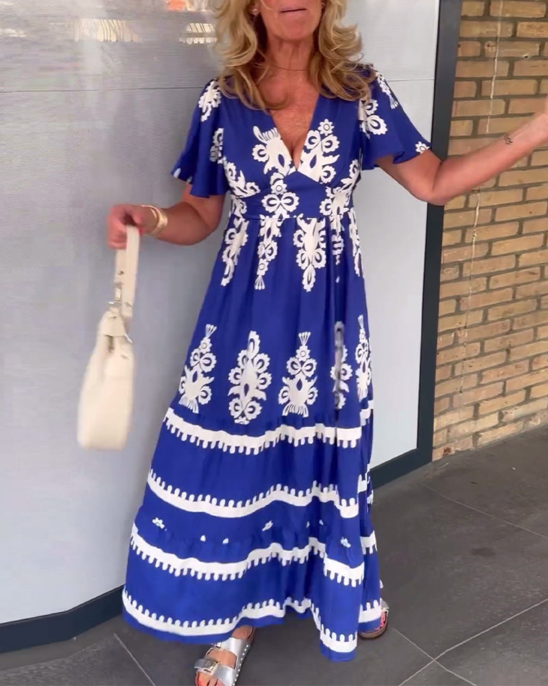 Elegant lang kjole med v-hals med vintage trykk