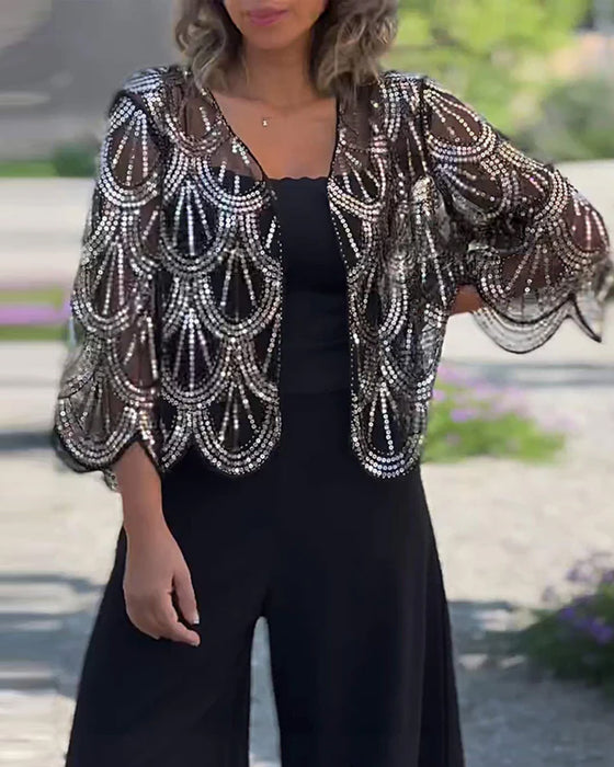 Elegant kåpe med paljetter og bølgekant